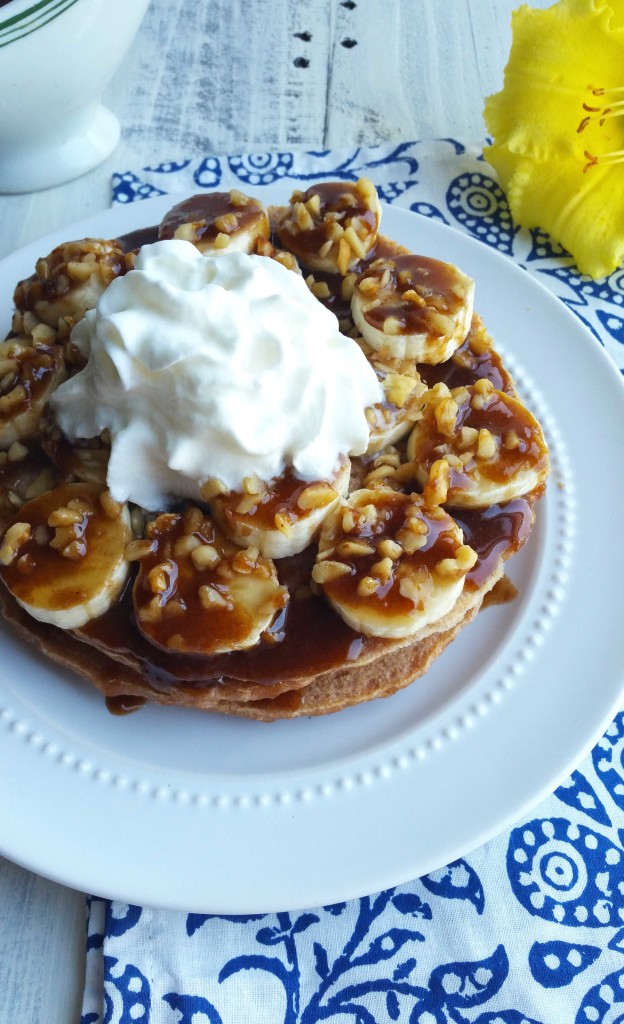 These Whole Wheat Bananas Foster Pancakes have homemade caramel sauce, bananas and walnuts on top of a bed of whole wheat pancakes.  These are so much better than the box mix and worth the extra effort!  I try and substitute healthier ingredients whenever possible, so I opted to make these pancakes with whole wheat flour.