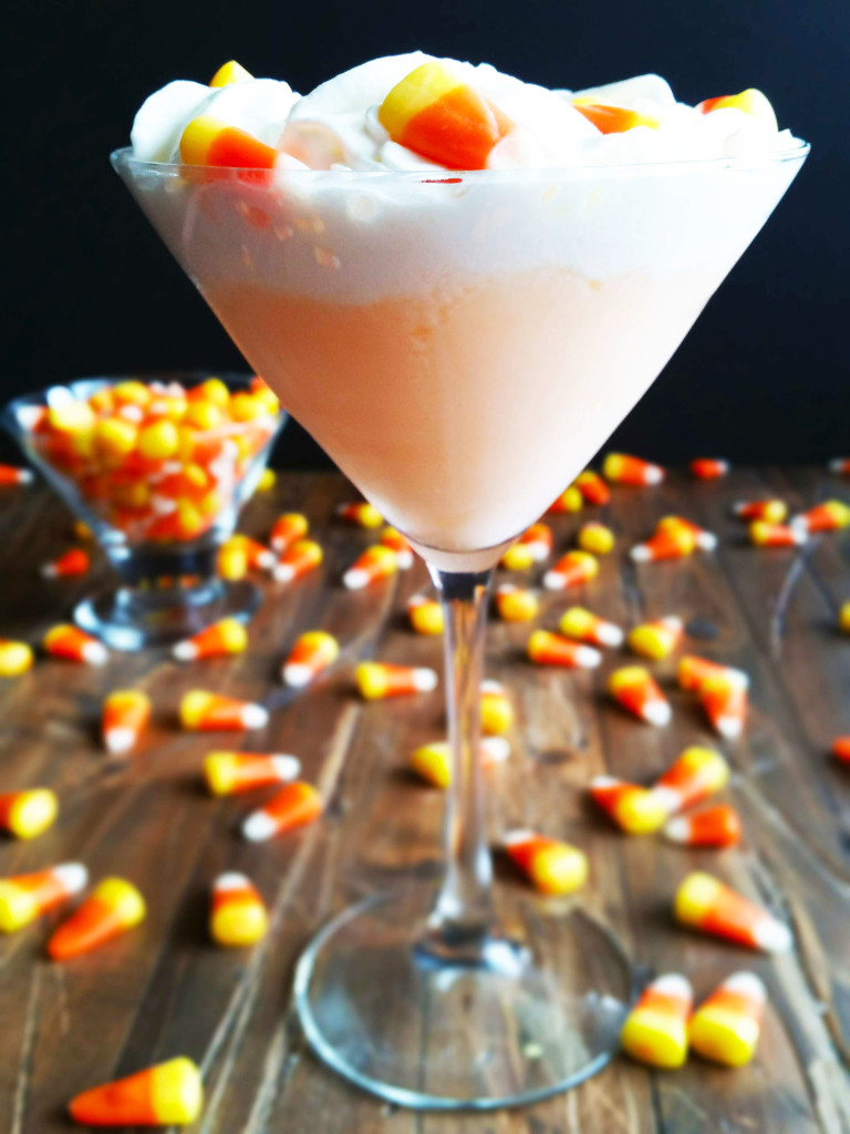 This Candy Corn Martini has infused vodka and a hint of butterscotch schnapps, half and half and pineapple juice.  Top it off with a heavy float of whipped cream and a some candy corns for this fun fall cocktail.  