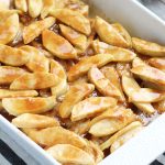 This overnight, Baked Apple French Toast Casserole has a warm, brown sugar, butter and cinnamon sauce.  It is my family's favorite breakfast recipe of all time.  A generous heaping of Granny Smith apples gets coated with a light dusting of cinnamon and sugar before baking it in the oven.