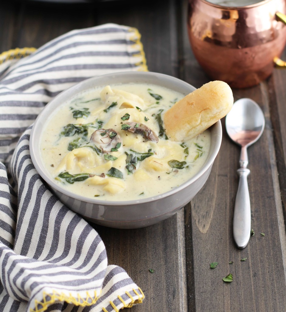 This Slow Cooker Creamy Tortellini Spinach and Mushroom Soup is the perfect way to warm up this winter.  It is loaded with cheese tortellini and is so creamy, dreamy and delightful! It is also easily made as a vegetarian soup by substituting vegetable broth.  