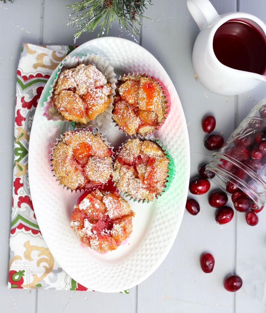 These Eggnog French Toast Cups with Cranberry Syrup are perfect for Christmas brunch.  The flavors of cinnamon and nutmeg taste so ambrosial with the fresh, cranberry syrup.  Add a sprinkle of powdered sugar and an extra bit of syrup before serving for a decadent treat that will have you hearing sleigh bells.