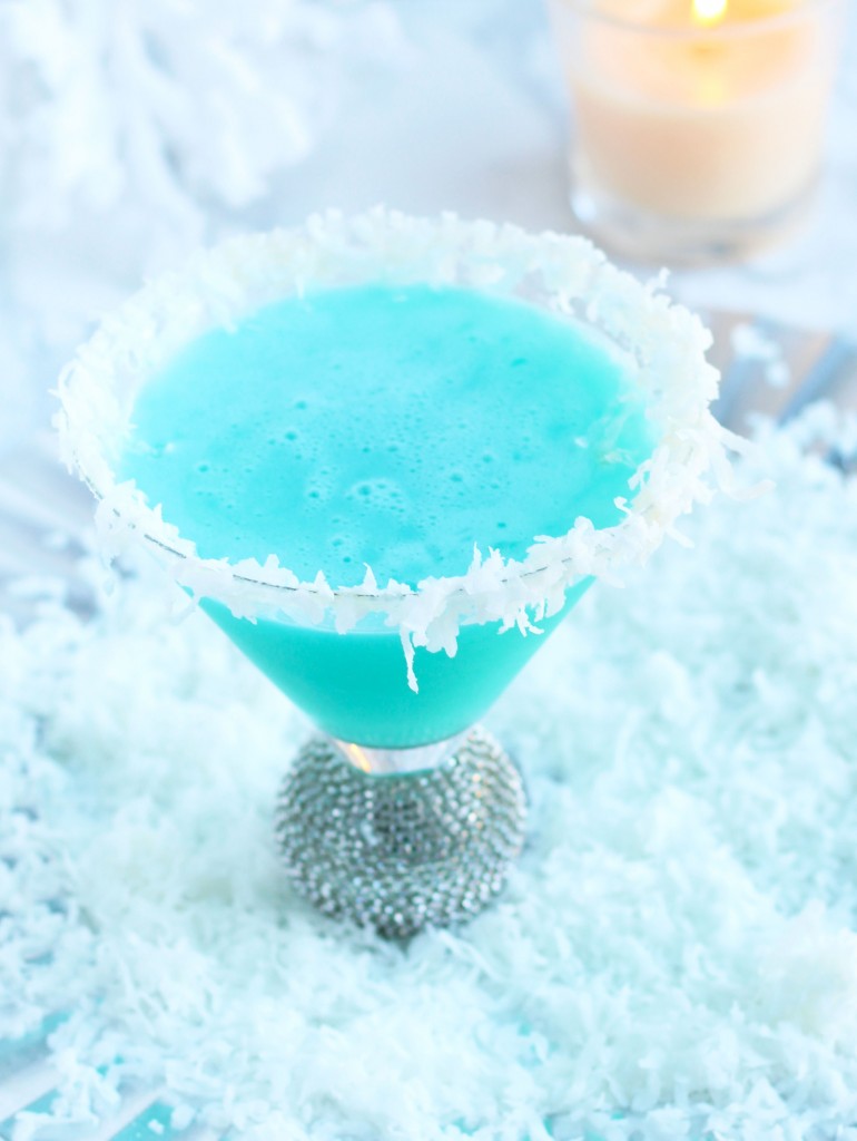 This Snowflake Martini is a winter wonderland with the flavors of Blue Curacao, pineapple and coconut.