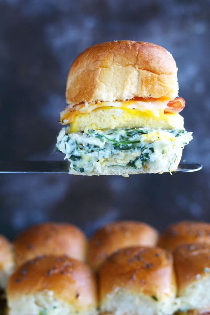 These Spinach Artichoke Dip Breakfast Sliders have a generous layer of my favorite dip with egg, ham and cheese on a Hawaiian roll.