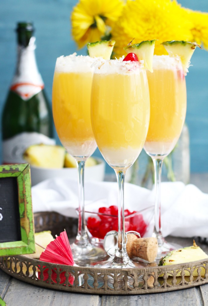These Tropical Mimosas are great for brunch with pineapple juice and coconut flavors.