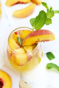 I've combined 2 of my favorite cocktails with this Fuzzy Navel Peach Sangria with White Moscato and fresh peaches.