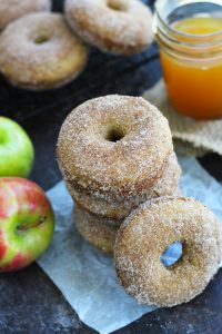 These Baked Apple Cider Doughnuts are bursting with apple flavor and are topped with cinnamon sugar.