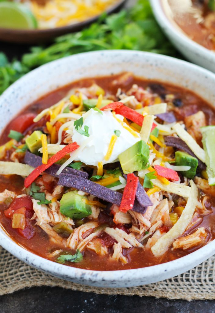 This hearty, Slow Cooker Chicken Tortilla Soup is perfect for busy nights and is loaded with all the best toppings.