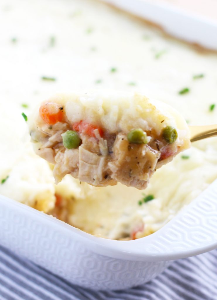 This Leftover Turkey Shepherd's Pie is a great way to use up all your Thanksgiving leftovers!  Carrots, celery and peas get simmered in a gravy sauce and baked with a topping of mashed potatoes.