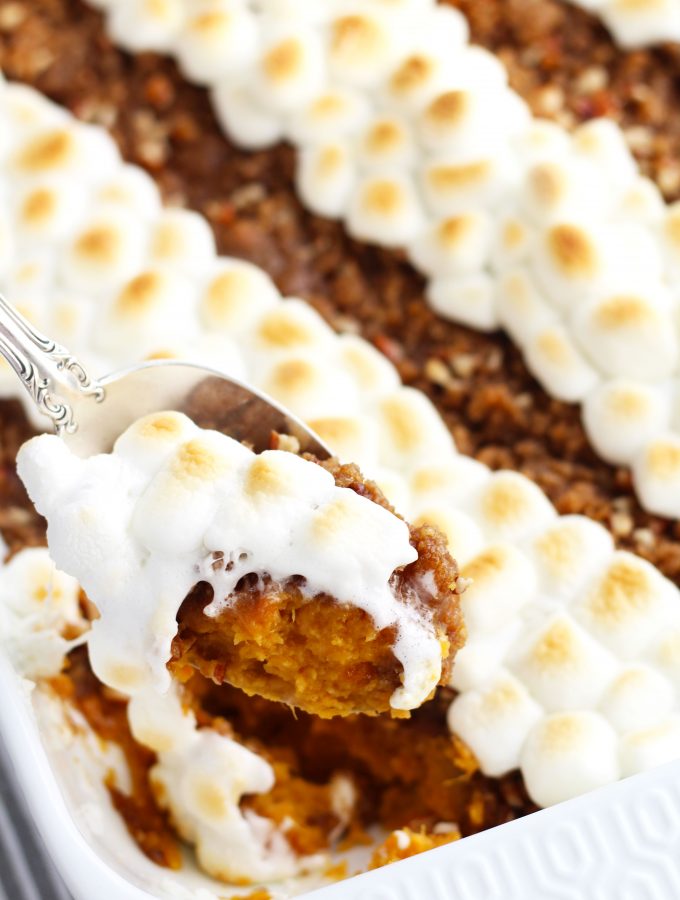 This Sweet Potato Casserole with Pecan Topping is easily put together the night before for a no fuss Thanksgiving day side dish.  The delectable brown sugar and pecan topping adds the perfect balance of soft and crispy textures.  Rows of marshmallows can be added for added sweetness and color.