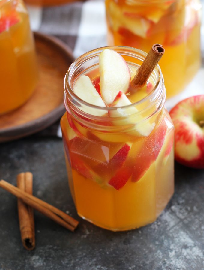 This Fireball Apple Cider Sangria is the perfect fall party cocktail. Fresh apples and cinnamon sticks add to this flavorful cocktail with apple cider, Pinot Grigio, Fireball Cinnamon Whisky and a splash of ginger ale.