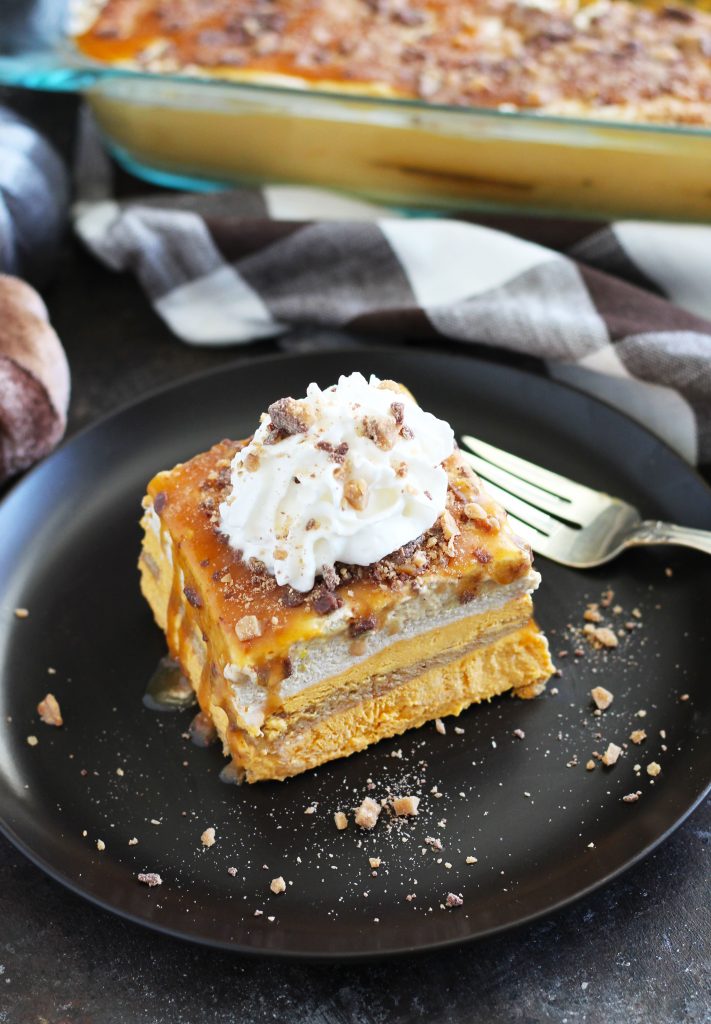 This No Bake Pumpkin Cheesecake Lasagna makes a quick and easy holiday dessert.  It has layers of cinnamon graham crackers, caramel sauce, pumpkin cheesecake, pudding and toffee bits for plenty of flavor.  Freeze it the night before for a no-fuss holiday dessert.