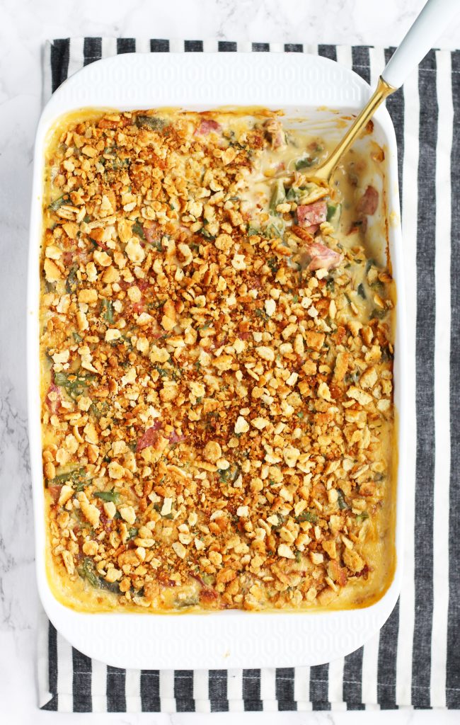 This Cheesy Bacon Green Bean Casserole has so much more flavor than the traditional version. Plenty of cheese is added with a crispy cracker topping.