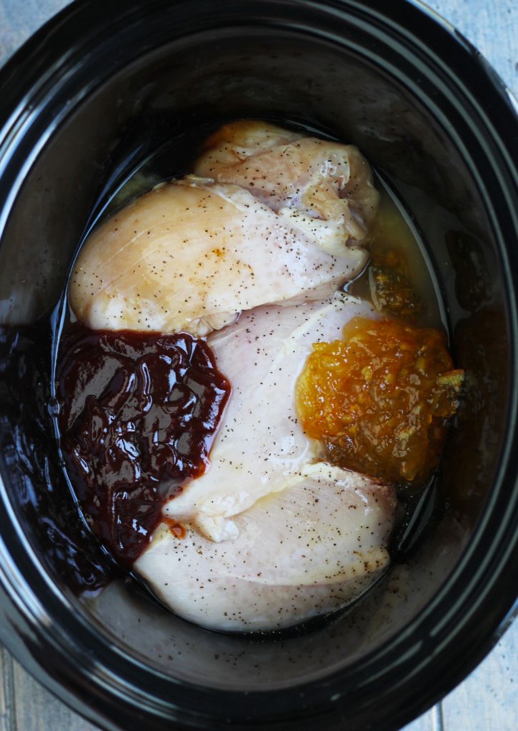 This Crockpot Orange Chicken is super easy to make with barbecue sauce, orange marmalade, soy sauce and orange juice.  It is part of my weekly dinner rotation and popular with the kids.  Serve it in a bowl over rice or stir-fried noodles with veggies for a complete meal.