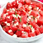 This Watermelon Salad with Feta and Mint is simple and refreshing for hot summer days.  A bit of honey and lime adds to the sweet, watermelon flavors with a topping of feta and fresh mint leaves.