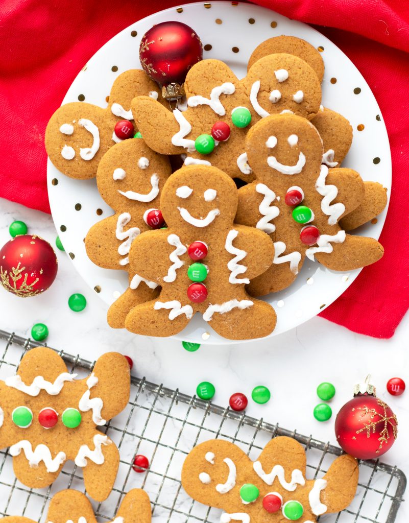 These Soft Gingerbread Cookies with Icing are so festive and easy for the holidays.  Add decorator icing and candies to make a gingerbread man or enjoy them plain for a quick addition to your cookie platter.