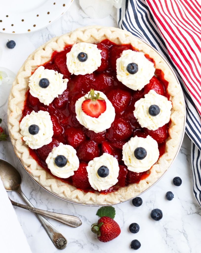 This Easy Fresh Strawberry Pie is perfect for summer BBQ's and 4th of July.  It is easily prepared with pre-made pie crust with a fresh strawberry filling that is thickened with a bit of Jell-O and cornstarch.  