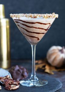 This Chocolate Turtle Martini with Pecan Whiskey, Crème de Cacao and Butterscotch Schnapps is a decadent cocktail that is perfect for entertaining.  It gets topped off with a caramel and rim with chopped pecans and a swirl of chocolate sauce.
