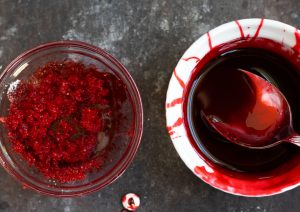 This easy, recipe for fake blood is perfect for Halloween cocktails with corn syrup, red food coloring and chocolate syrup.