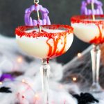 This Vampire's Kiss Martini will make the perfect addition to your upcoming Halloween parties.  Vanilla vodka, Amaretto and pineapple juice make this cocktail sweet and flavorful.  The addition of a bloody rim made from corn syrup and chocolate syrup creates a spooky presentation.