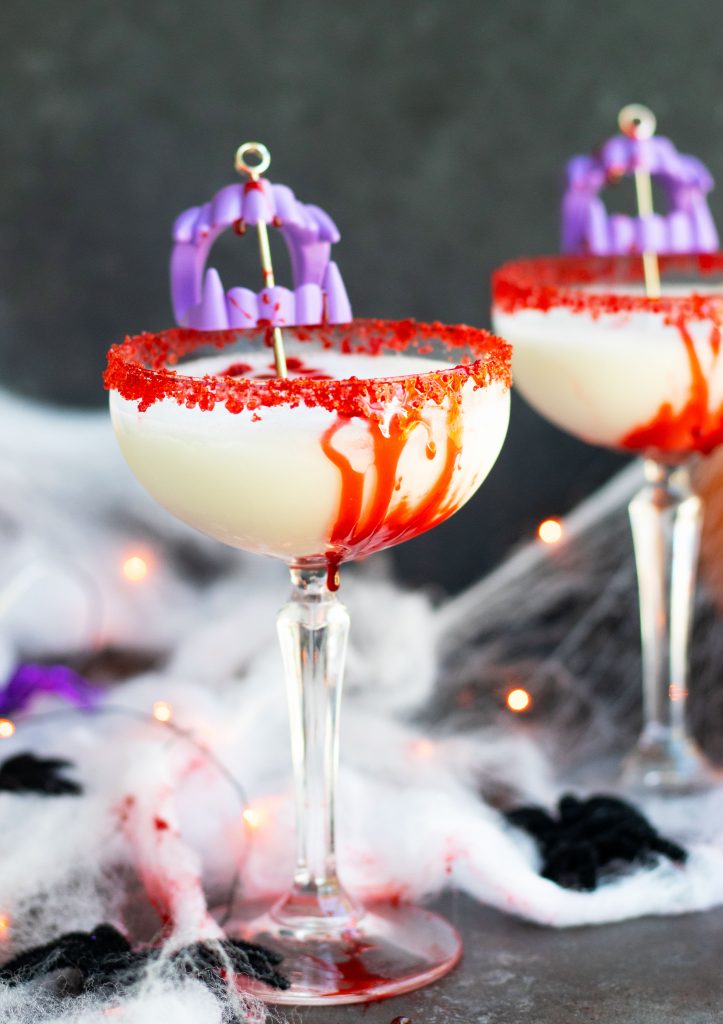 This Vampire's Kiss Martini will make the perfect addition to your upcoming Halloween parties.  Vanilla vodka, Amaretto and pineapple juice make this cocktail sweet and flavorful.  The addition of a bloody rim made from corn syrup and chocolate syrup creates a spooky presentation.