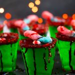 These Zombie Brain Margarita Jello shots with lime Jello, triple sec, lime juice and gold tequila are perfect for Halloween parties.  Top these spooky treats off with fake blood, gummy worms and a sugared rim.  
