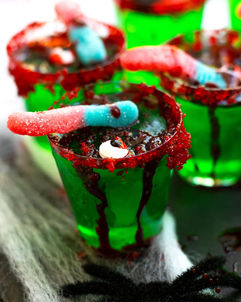 These Zombie Brain Margarita Jello shots with triple sec, lime juice, lime-flavored Jello and gold tequila are perfect for Halloween parties.  Top these little treats off with fake blood, gummy worms and a red sugared rim for a spooky effect.  