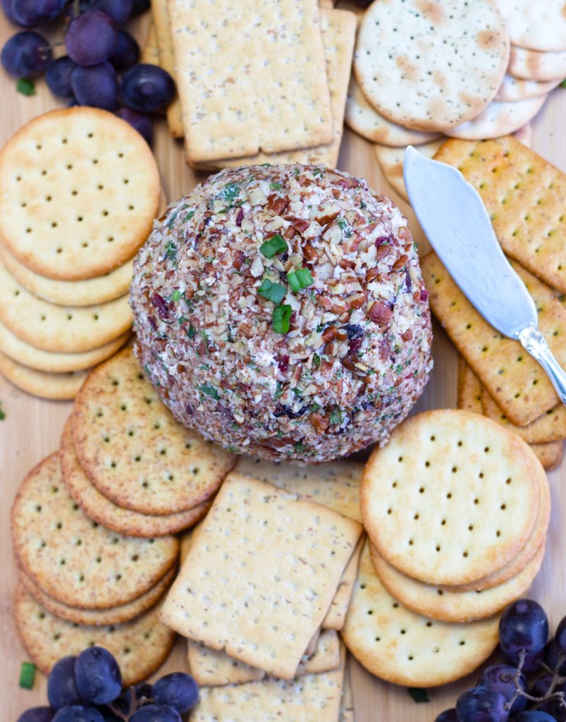 This Cranberry Pecan Cheese Ball is so festive for the holidays and easily made with only 5 ingredients.  Make it the day before for a worry-free holiday celebration.  Serve it with your favorite crackers, pretzels or veggies.