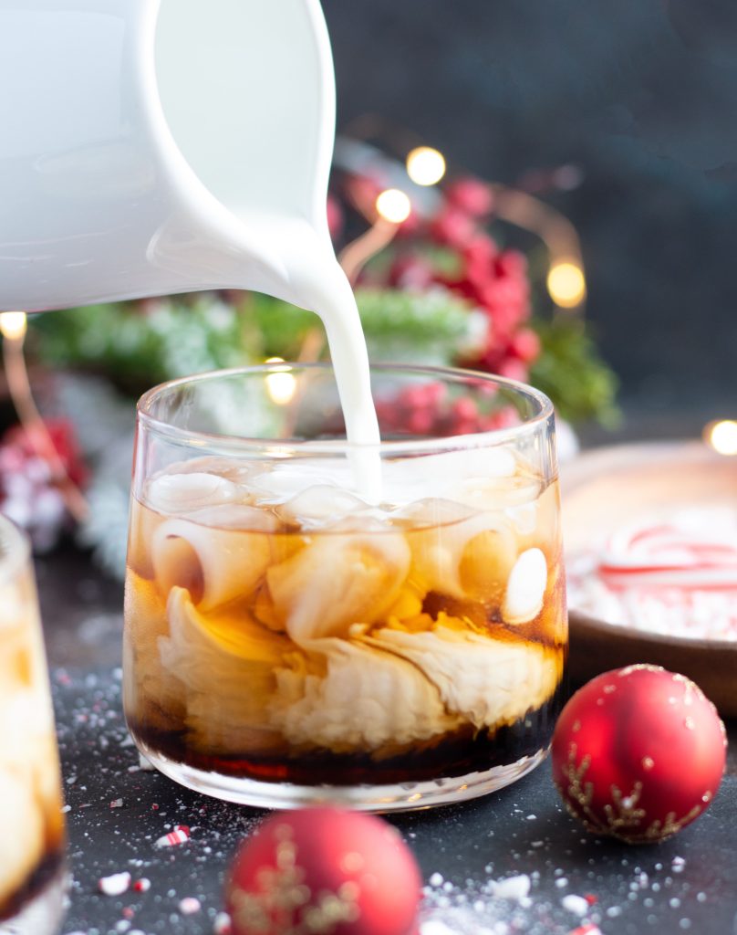 This Peppermint White Russian is perfect for entertaining during the holidays with Peppermint Vodka, Kahlua and Half & Half.  Add whipped cream and crushed candy canes for a festive topping.