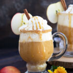 This Fireball Apple Cider Float is the perfect amount of sweet with a little action from the Fireball and Peach Schnapps.  A cinnamon sugar rim and caramel sauce top off this delightful fall cocktail.